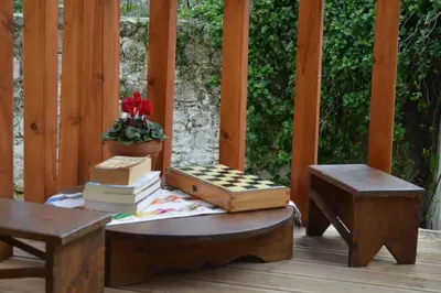 a porch with a table with books on it at Summer Knights in Rhodes Town