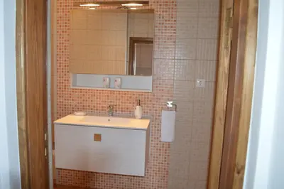 a bathroom with a sink and a mirror at Summer Knights in Rhodes Town