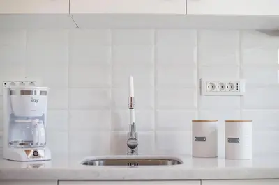 a kitchen counter with a mixer and a sink at Traditional Luxury House in Kalithies