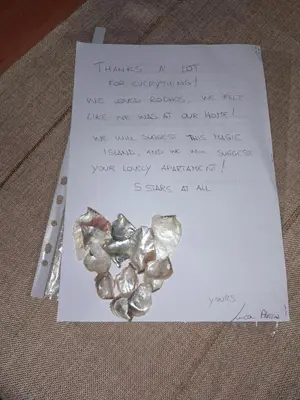 a piece of paper with a heart made out of rocks at Kypseli studio rhodes in Kremasti