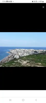 a view of a city with the ocean and buildings at Kypseli studio rhodes in Kremasti