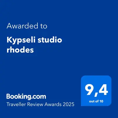 a blue screen with the text awarded to kyrzbek studio studios at Kypseli studio rhodes in Kremasti