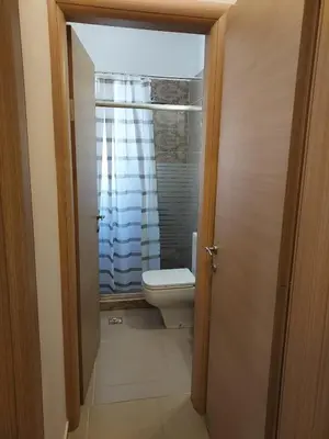 a bathroom with a toilet and a window at Luxury Rhodian Panorama in Ixia