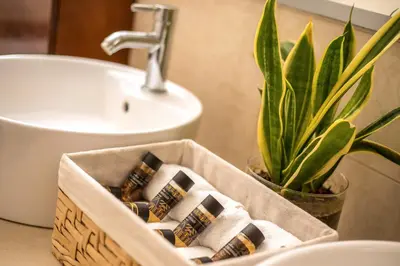 a bathroom with a sink and a box of cigarettes at Summer Dream Villa in Afantou