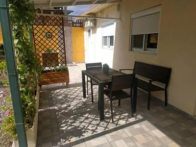a black table and chairs on a patio at Casa Georgia in Faliraki