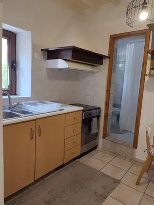 a kitchen with a sink and a stove at Old Town Maisonette in Rhodes Town