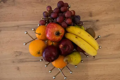 a bunch of fruit in the shape of a face at Kamelia Apartment in Rhodes Town