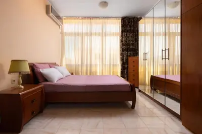 a bedroom with a bed and a window at Green Sunshine in Theologos