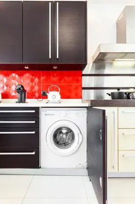 a kitchen with a washing machine in a kitchen at Unique Sea & Sunset Residence in Ixia