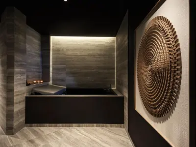 a bathroom with a bath tub in a room at Ammades All Suites Beach Hotel & Spa - Adults Only in Faliraki