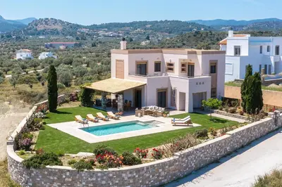 an aerial view of a house with a swimming pool at Majestic View Villa in Kolimbia