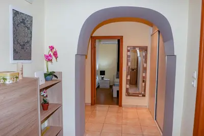 a hallway with an archway leading into a room at Lana's House in Rhodes Town