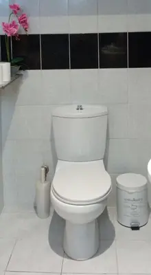 a bathroom with a white toilet in a room at Lana's House in Rhodes Town