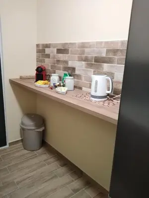 a kitchen counter with two toasters on it at Serafi Cozy Rooms in Archangelos