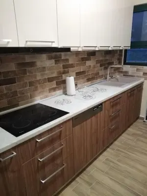 a kitchen with a sink and a counter top at Serafi Cozy Rooms in Archangelos