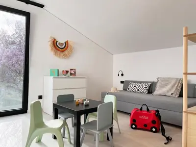 a living room with a table and a couch at Maison A Rhodes with 66m2 heated pool on a 4800m2 plot in Koskinou