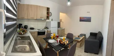 a small kitchen with a small table in a kitchen at Escape Rooms in Afantou