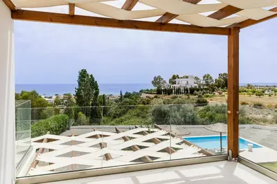 a view of the pool from the balcony of a house at Villa Santa Maria with private pool and sea view in Afantou