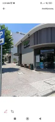 a building with a parking sign in front of it at Aegean Living in Rhodes Town