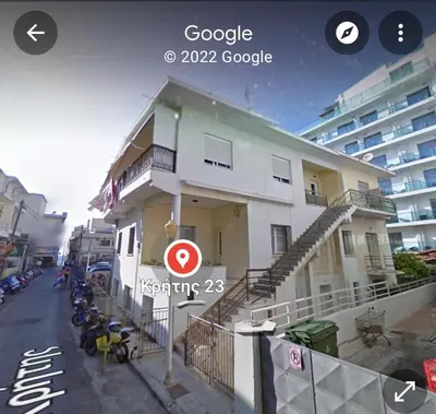 a building with motorcycles parked in front of it at Great Living in Rhodes Town