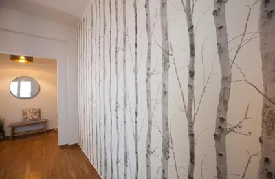 a hallway with a wall mural of trees at Great Living in Rhodes Town