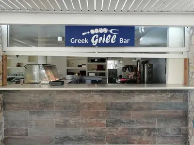 a restaurant counter with a sign for a great chef bar at Villa Mare by Delfinia Resort in Kolimbia