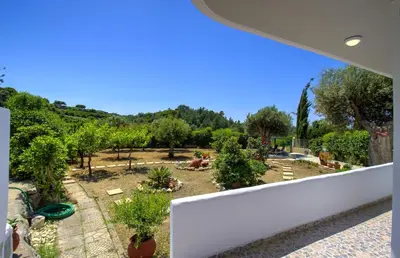 a view of a garden from the balcony of a house at Villa Bella Montagna in Kapíon