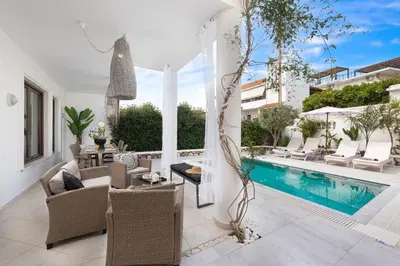a villa with a swimming pool and a patio at Mikaela's Pool House in Afantou