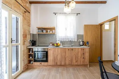 a kitchen with a sink and a stove at Medieval Poem in Rhodes Town