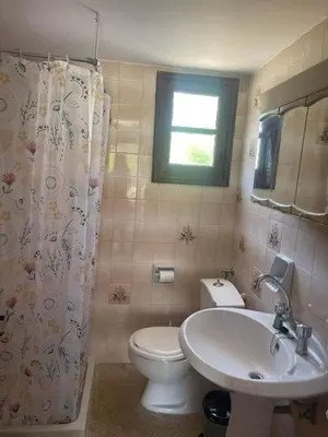a bathroom with a toilet and a sink at Aegean Endless Summer Villa Pefkos in Pefki Rhodes