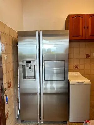 a stainless steel refrigerator in a kitchen at Aegean Endless Summer Villa Pefkos in Pefki Rhodes