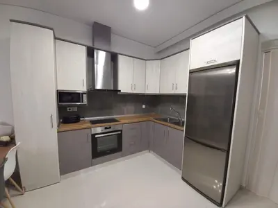 a kitchen with a stainless steel refrigerator at Andreas Apartment in Rhodes Town