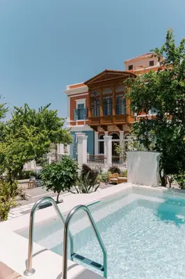 a swimming pool in front of a house at Saray Monumental Luxury Villa Medieval Town, Rhodes in Rhodes Town