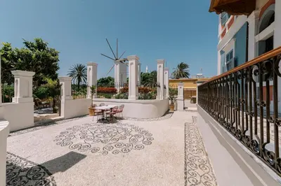 a balcony of a house with a table at Saray Monumental Luxury Villa Medieval Town, Rhodes in Rhodes Town