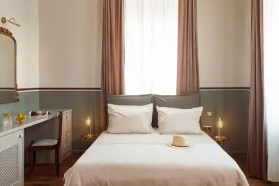 a bedroom with a bed with a hat on it at Saray Monumental Luxury Villa Medieval Town, Rhodes in Rhodes Town