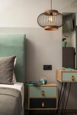 a bedroom with a bed and a nightstand with a lamp at Haraki Blue Dream Luxury Apartments in Haraki