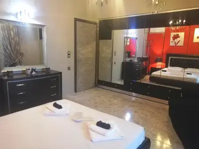 a bathroom with two towels on a table with a mirror at EnjoyRhodes Villa near Faliraki in Kalithies