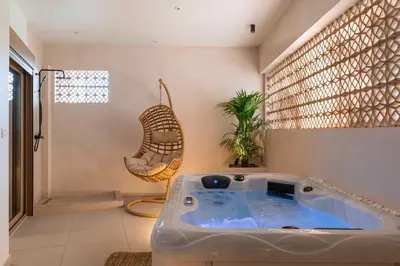 a bathroom with a jacuzzi tub in a room at Mariann Premium Suites in Lardos