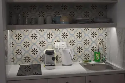 a kitchen counter top with a sink and a counter top at Pervoli in Faliraki