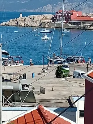 a view of a marina with boats in the water at Casa Con Vista Apartments in Halki