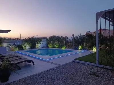 a swimming pool in the backyard of a house at Casa di Rea Sanfilippo in Soroni