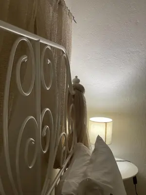 a wooden headboard of a bed in a bedroom at Marina Castellana Studios II in Halki