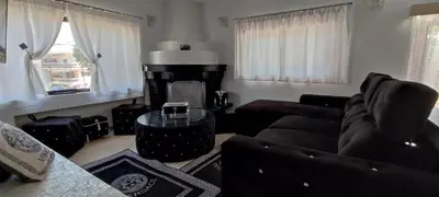 a living room with a couch and a table at Ixian House Apartment in Ixia