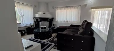 a living room with a couch and a table at Ixian House Apartment in Ixia