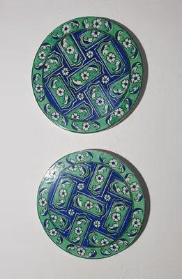 a blue and green plate with animals on it at Toulipa Lindos in Líndos