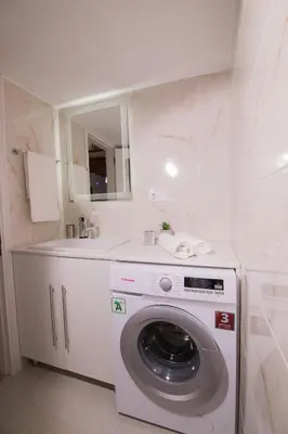 a washing machine in a bathroom with a sink at SOFI'S house in Rhodes Town