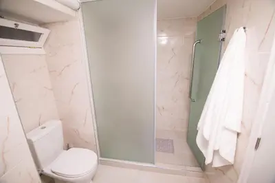 a bathroom with a shower and a toilet at SOFI'S house in Rhodes Town