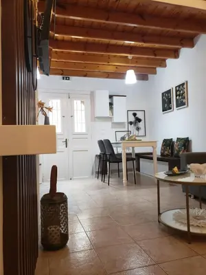 a living room with a table and chairs at SOFI'S house in Rhodes Town
