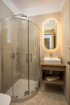 a bathroom with a shower and a sink at Sea Homes Villas-Villa Sylvia in Kiotari