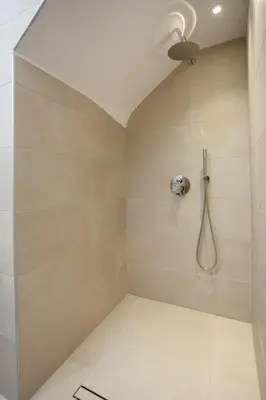 a bathroom with a shower with a ceiling at Sea Homes Villas-Villa Sylvia in Kiotari